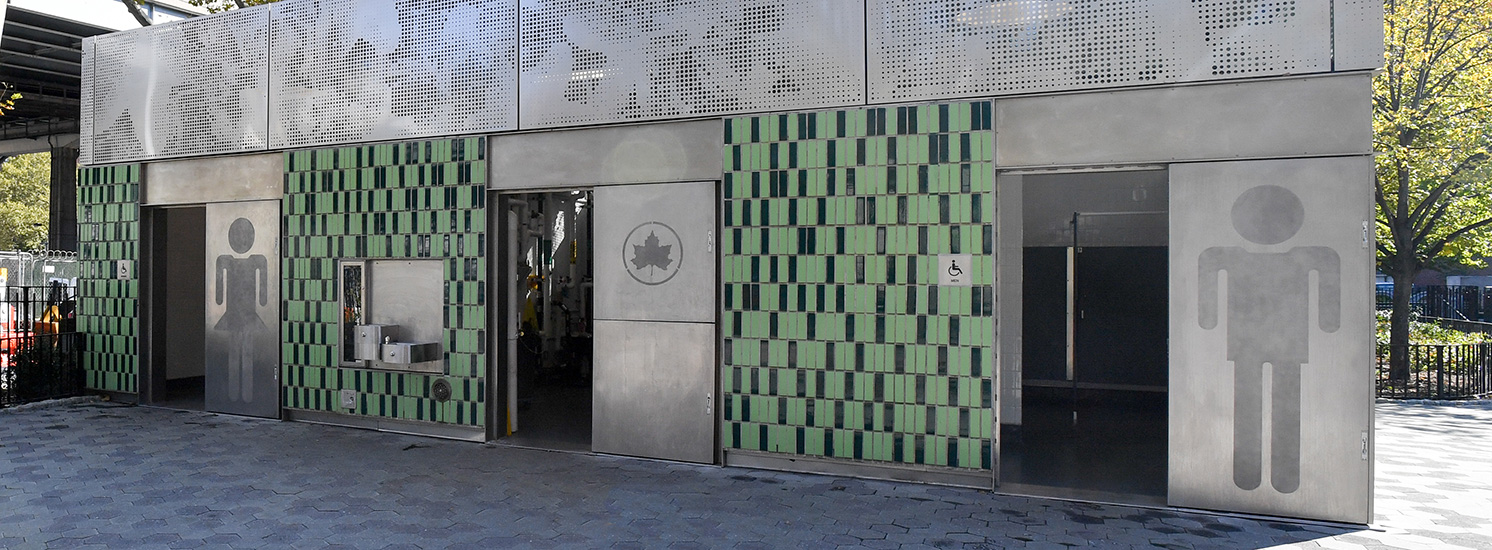 A modern-looking bathroom with men's, women's and gender-neutral entrances.