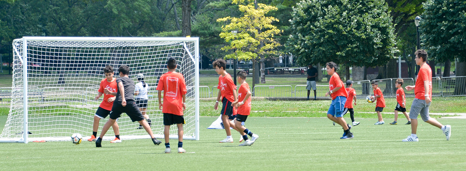 A group of children playing soccer.