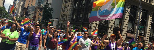 New Yorkers and Parks employees march in the Pride March on Fifth Avenue in Manhattan