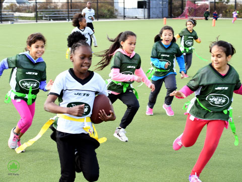 Girls playing flag football.