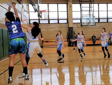 Junior Knicks Basketball League girl players play basketball