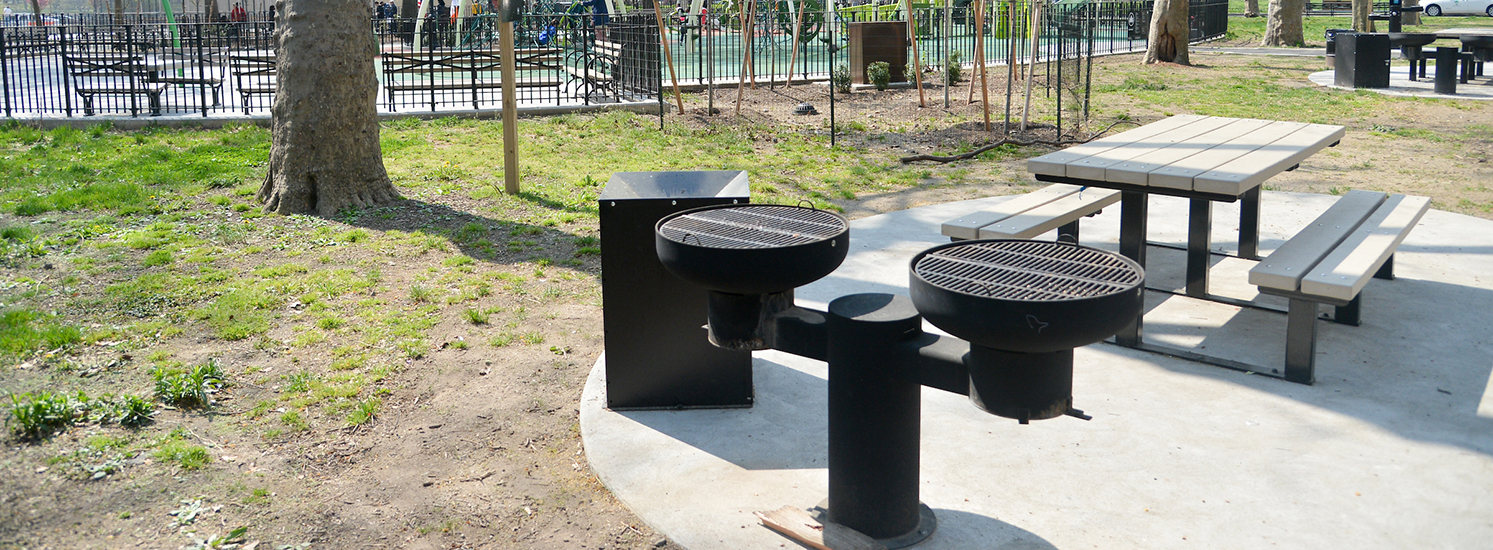 A charcoal grill in a city park