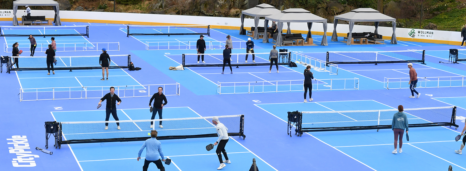 Rows of pickleball courts seen from above.