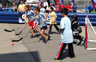 Kids playing street hockey