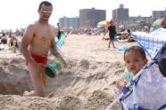 Man and infant digging hole. 