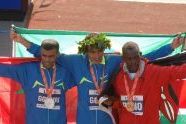 Second place Abderrahim Goumri of Ethiopia, first place Marilson Gomes dos Santos of Brazil, and third place Daniel Rono of Kenya 