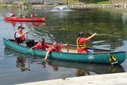 Children test the temperature of the restored lake 