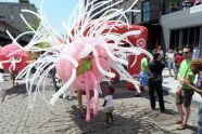 A child inspects a balloon costume by Jason Hackenwerth 