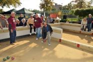 Bronx Parks Commissioner Hector Aponte tests his bocce skills on the court 