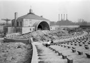 Children observing progress on amphitheater 