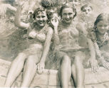 Smiling women and children, outdoor swimming pool (Location probable) 