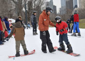 Receiving snowboarding instruction 