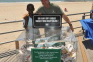 Parks Commissioner Adrian Benepe and a Hungry Beach Opening Attendee 