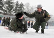 A man is instructed in the ways of ice rescue. 