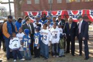 Young athletes pose with officials 