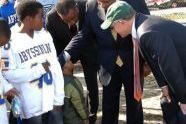 Ed Lewis, Charles Rangel, and Woody Johnson interview a future athletic star 