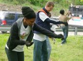 Volunteers sprinkle the lawn 