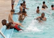 Boys gather in the pool 